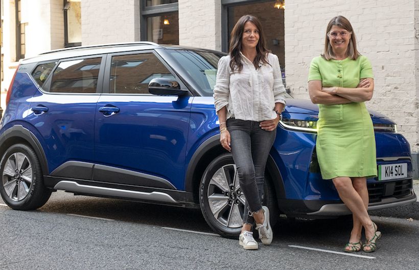 Ginny Buckley with Rachel Maclean MP and a Kia Soul EV